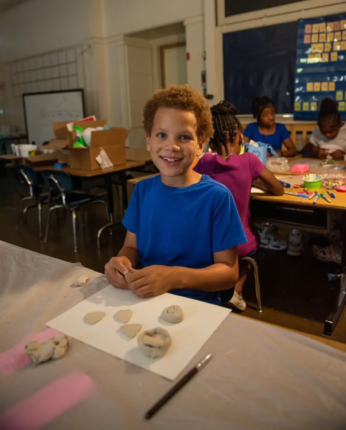 A student making a clay project during an Athena enrichment class