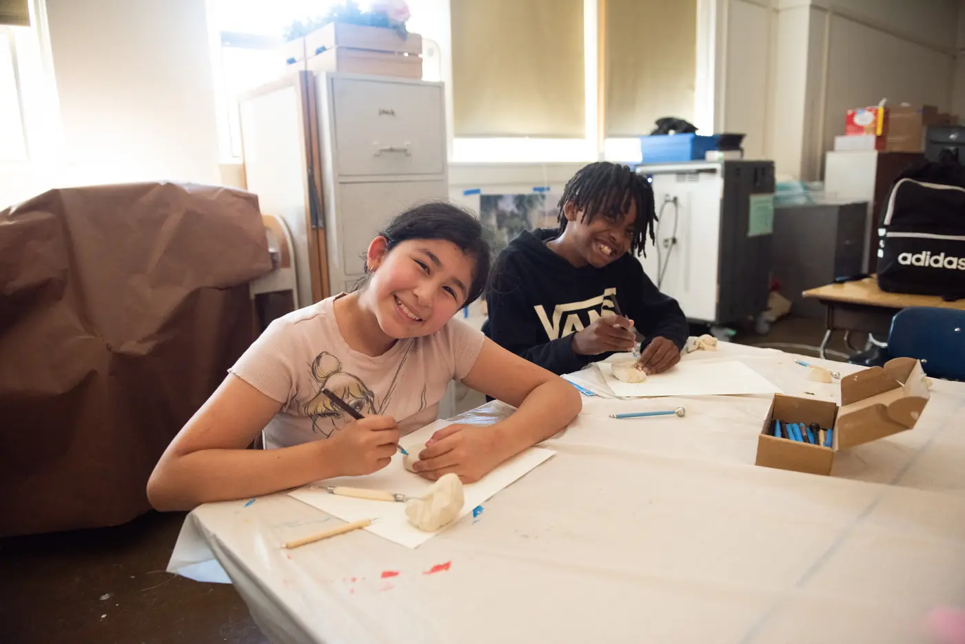 Students working on creative projects in an Athena classroom